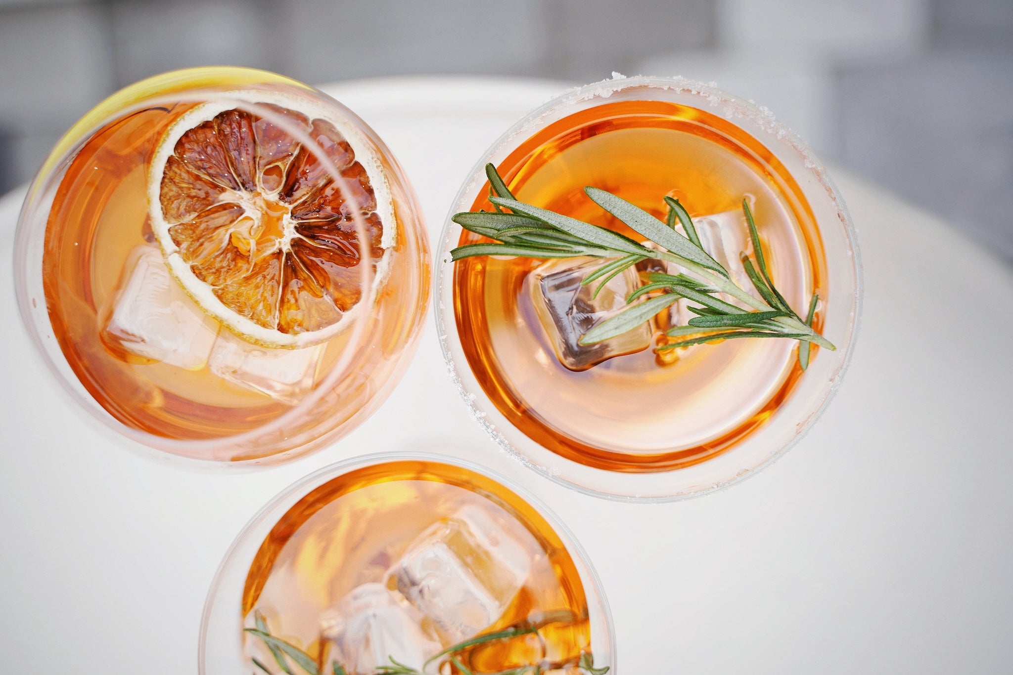 orange mockatils with rosemary and blood orange garnish