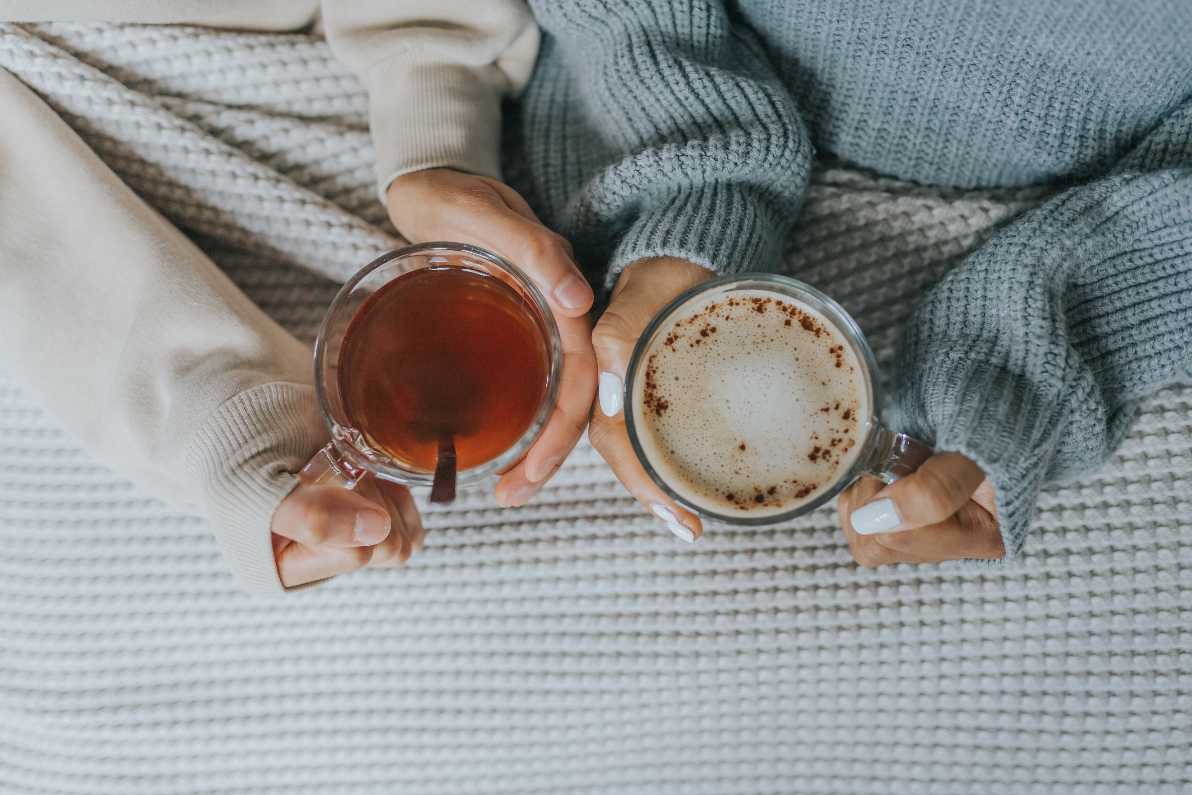 Couple in bed with cozy relaxing teas