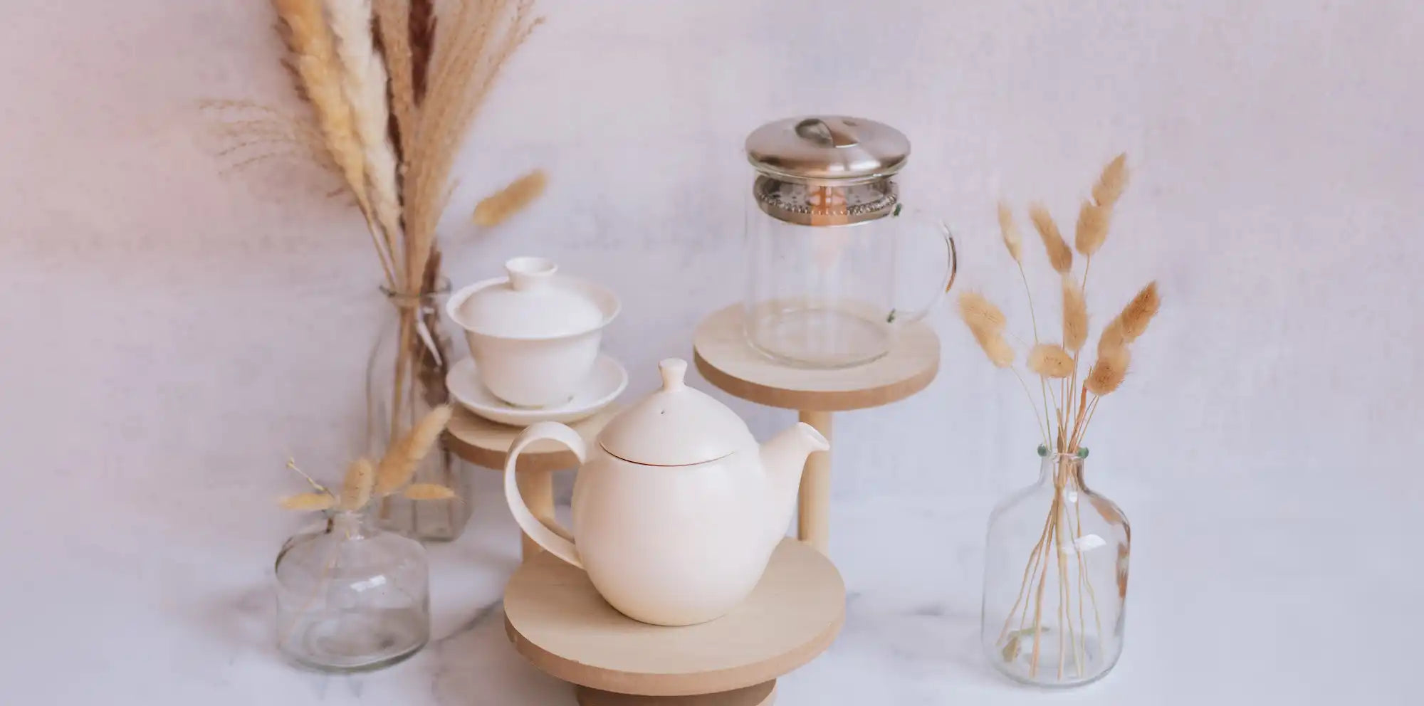 dew teapot, white purity gaiwan, and glass infuser with dried florals