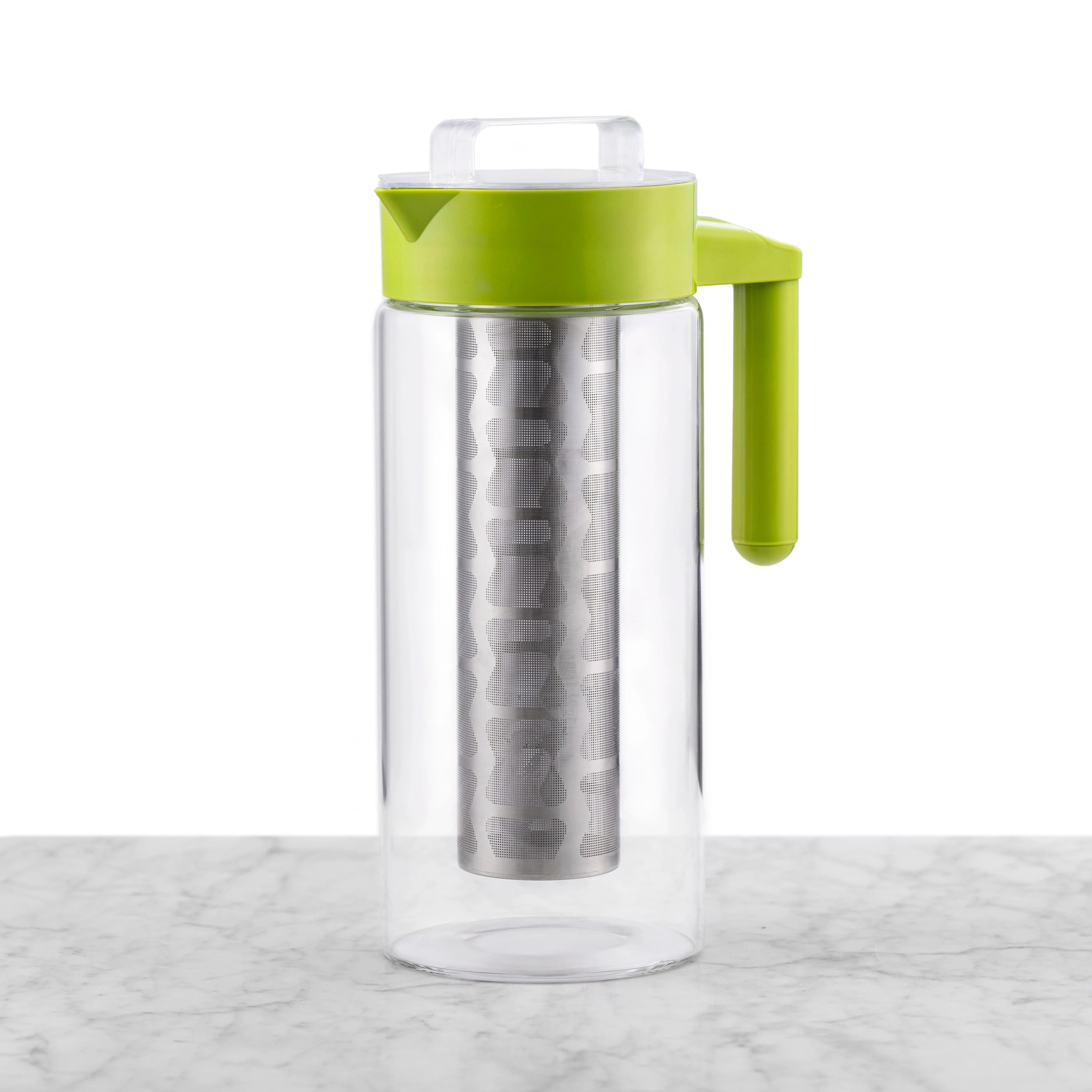 Clear glass cold tea maker featuring a green handle and lid and a removable stainless steel mesh filter.