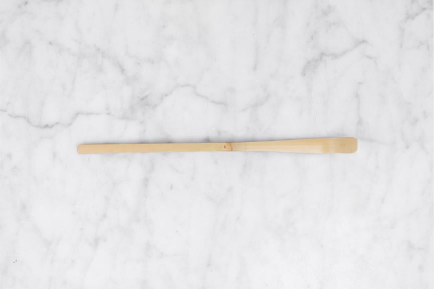 aerial view of bamboo matcha scoop on a marble background