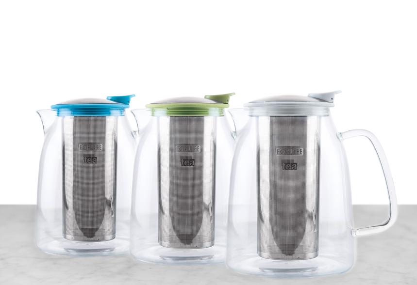 line of three glass loose leaf teapots with blue, lime green, and white tops