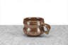 hand thrown local NY pottery brown tea or coffee mug with beveled sides and a thumbprint handle