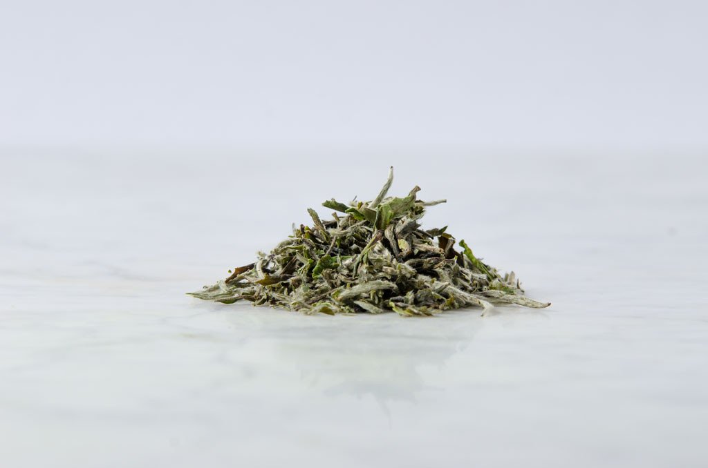 pile of loose leaf bai mu dan wang white peony tea
