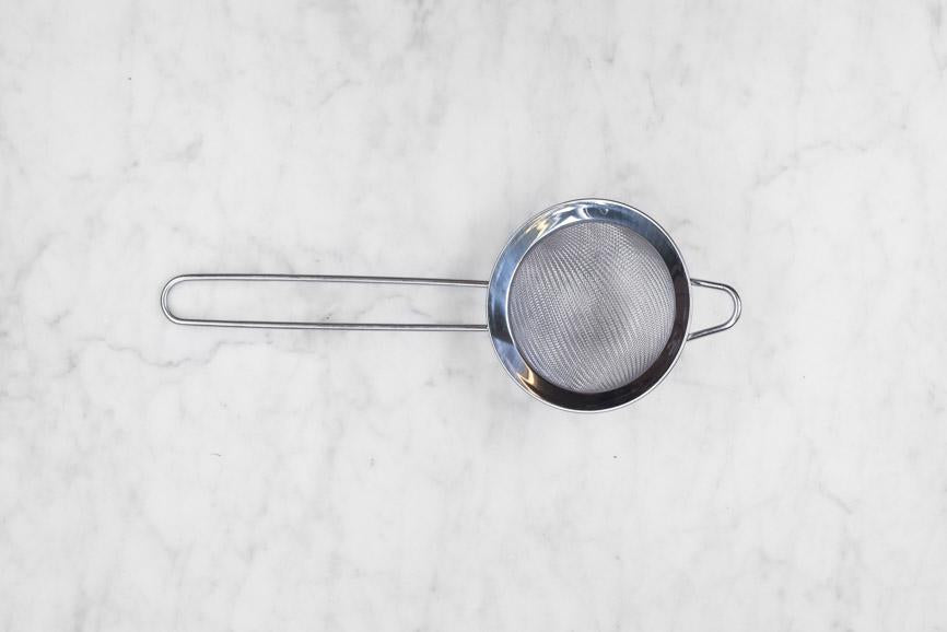 matcha sifter on a marble background