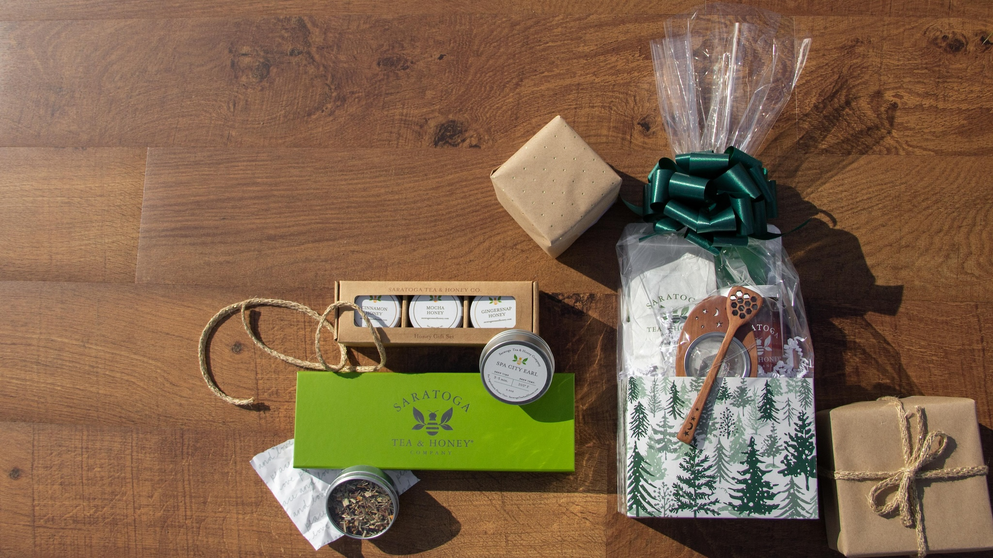 tea gift sets on a wood background with wrapped packages