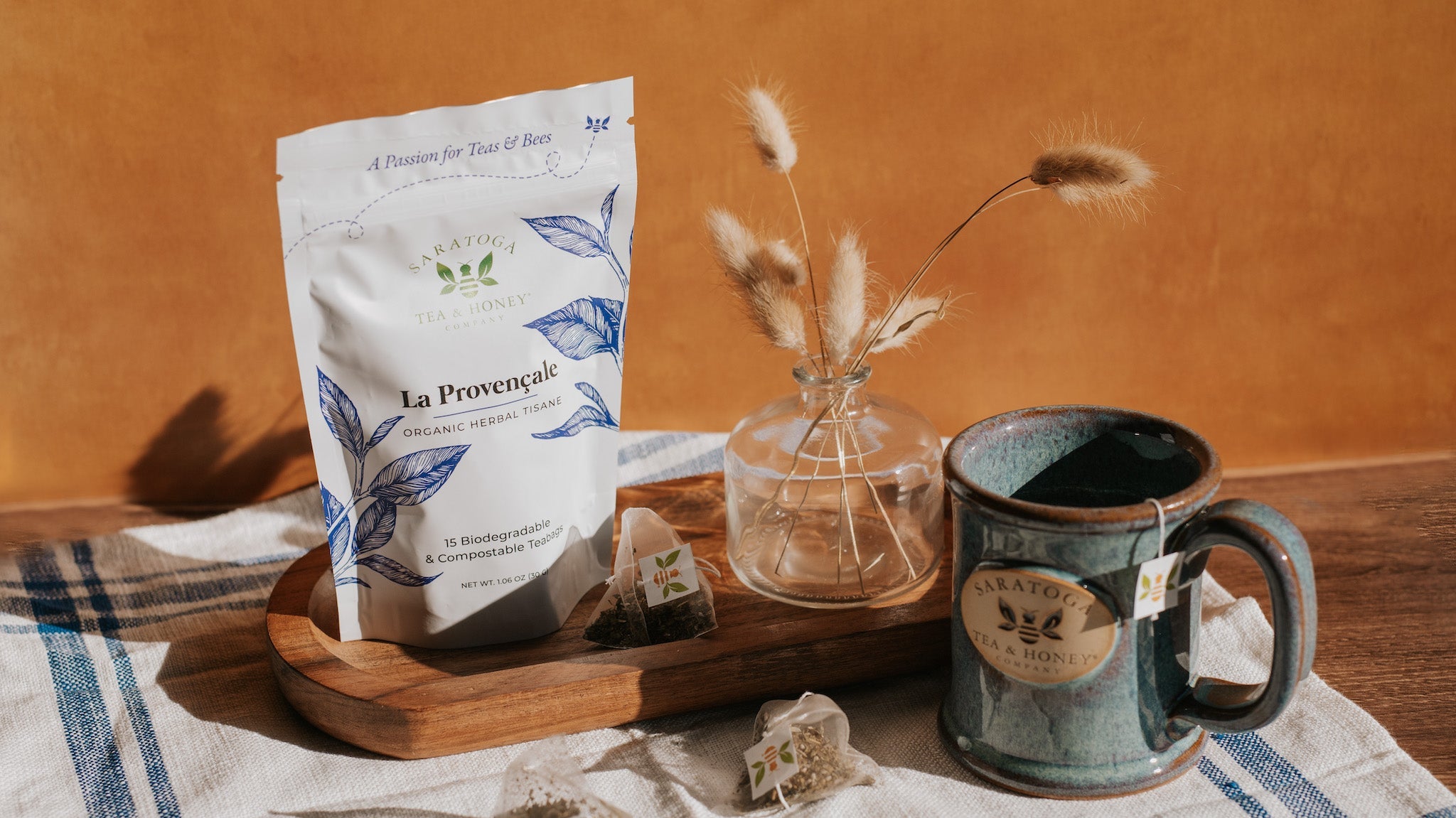 la provencale tea sachet bag and loose sachets of tea with a blue mug