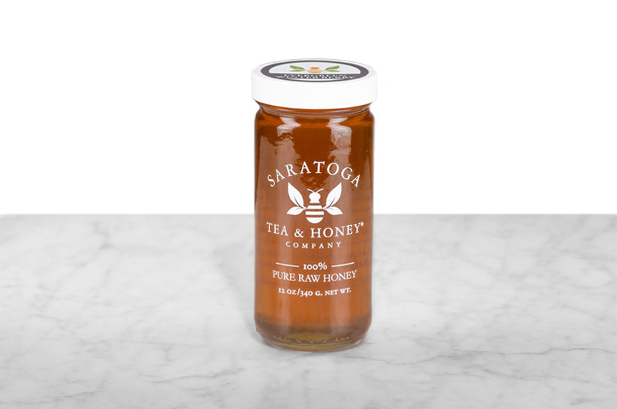 A jar of Evergreen Winterberry Honey.