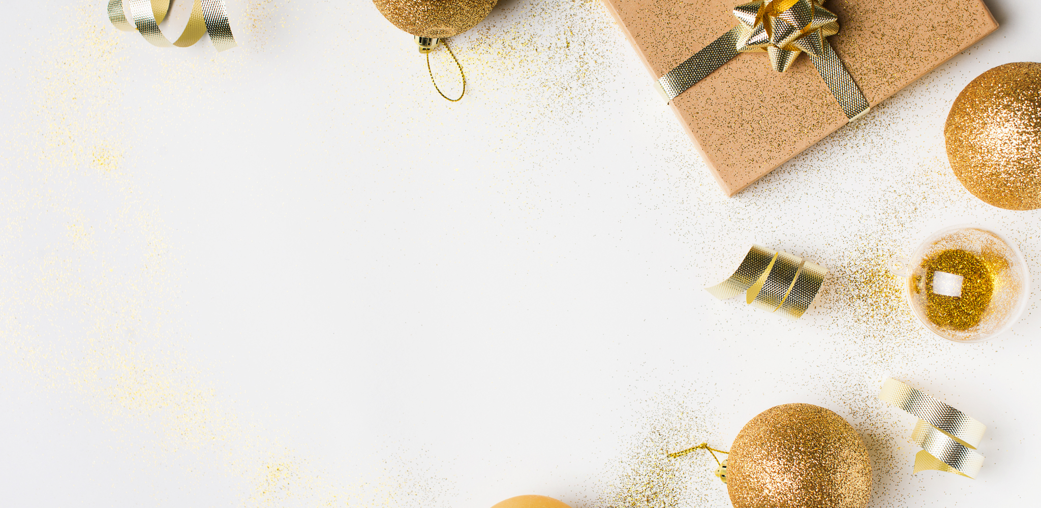white and gold background with gold gifts, confetti and holiday ornaments