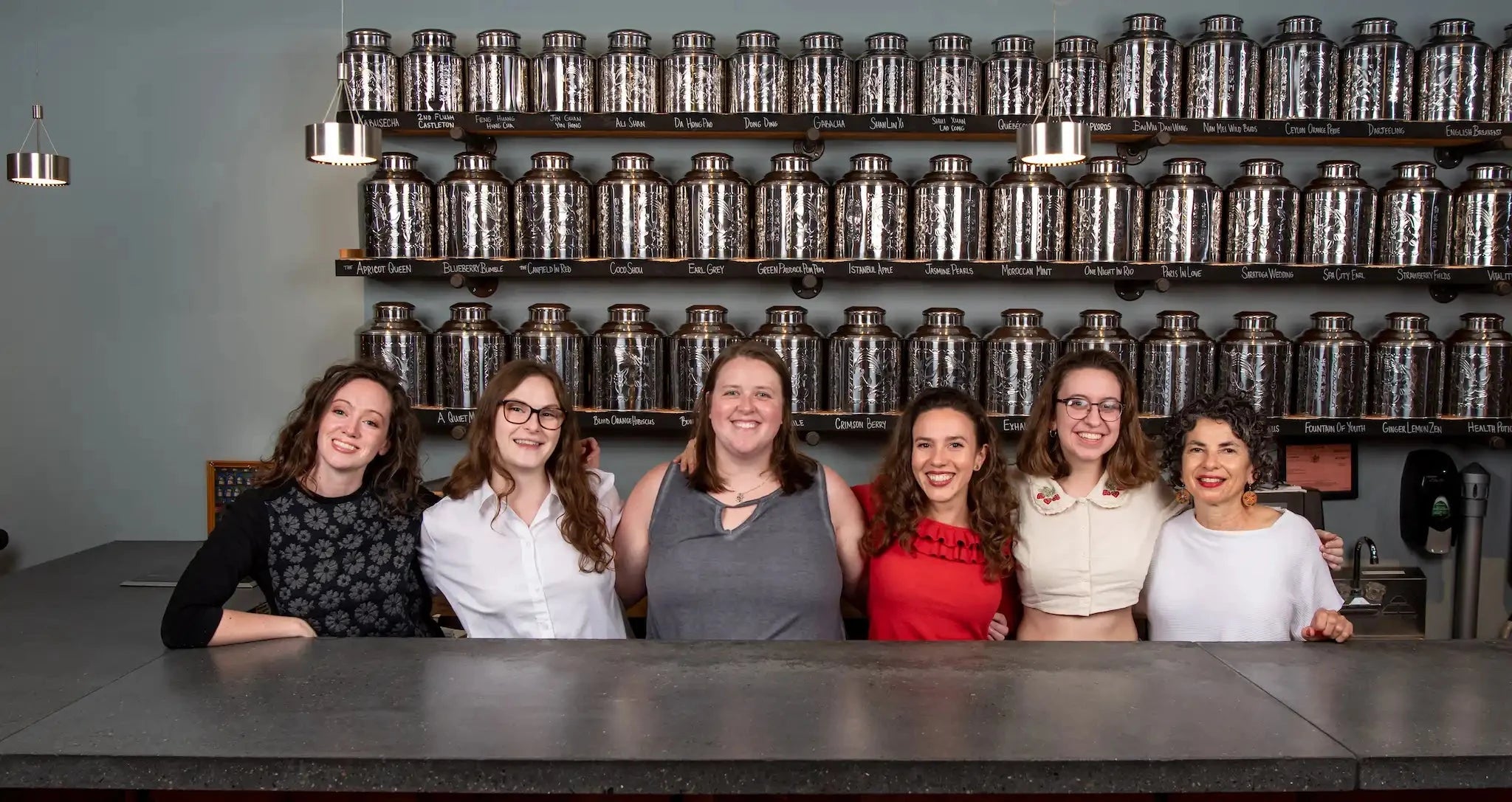 photo of management TEAm from Saratoga Tea & Honey Co. behind the tea bar