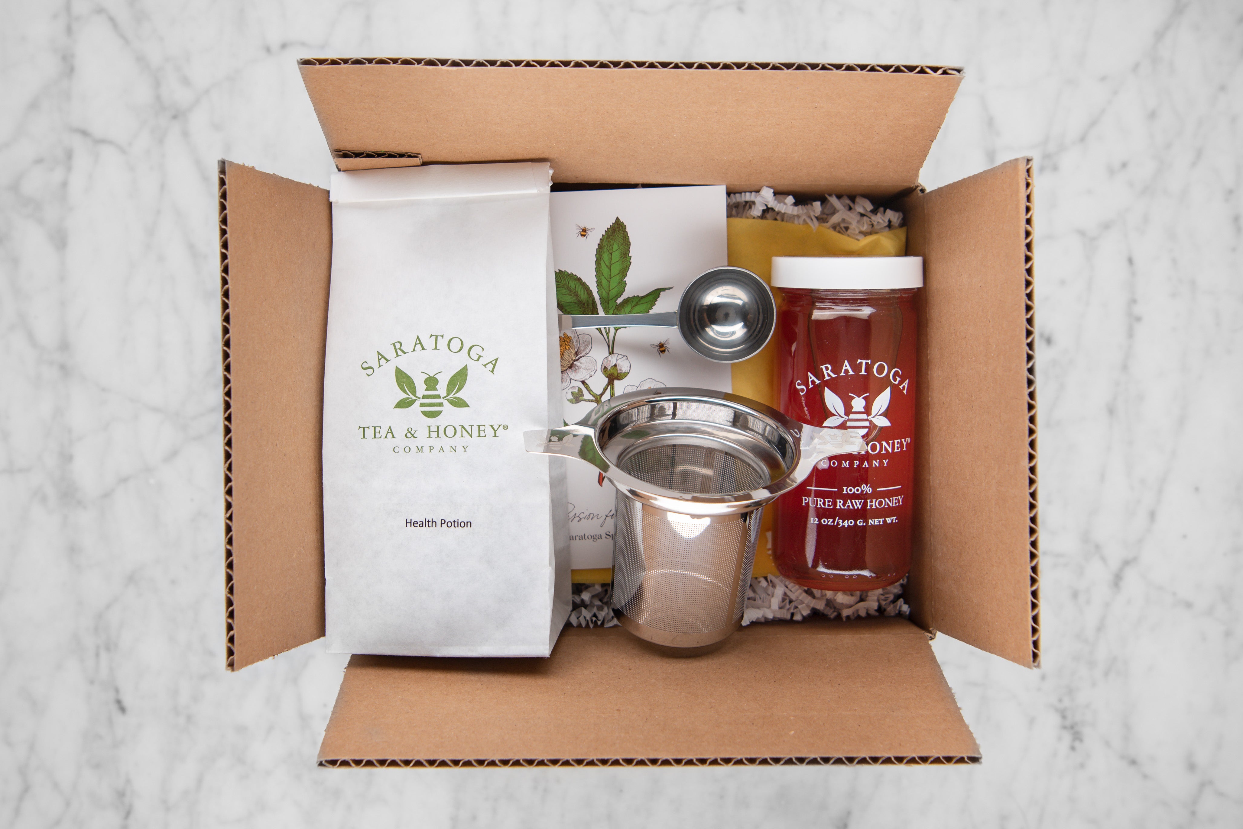 Get well soon box with health potion herbal tea, tea infuser, tea scoop, and elderberry infused honey