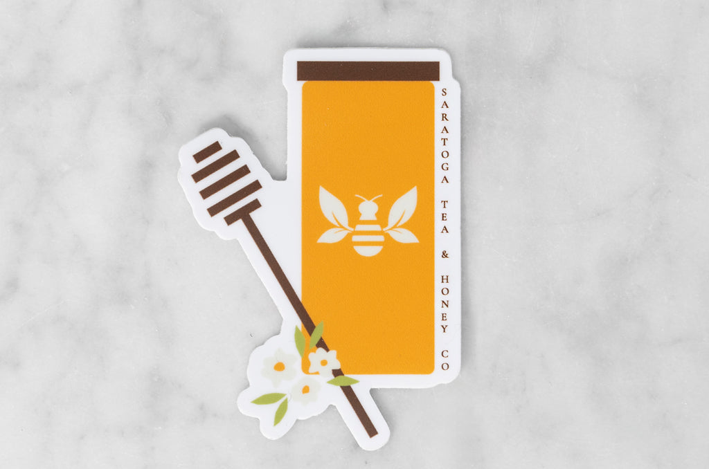 vinyl sticker featuring illustration of a Saratoga Tea & Honey Co. honey jar with a honey dipper and flowers