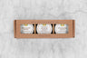 Sweater Weather Honey Trio Gift Set. Three mini 3oz honeys with white labels in a brown kraft box with a window. Features: Chocolate Honey, Orange Blossom Honey, Gingersnap Honey