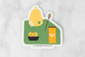 vinyl sticker featuring vignette of honey items: skep, honeycomb, honey jar, and honey dipper