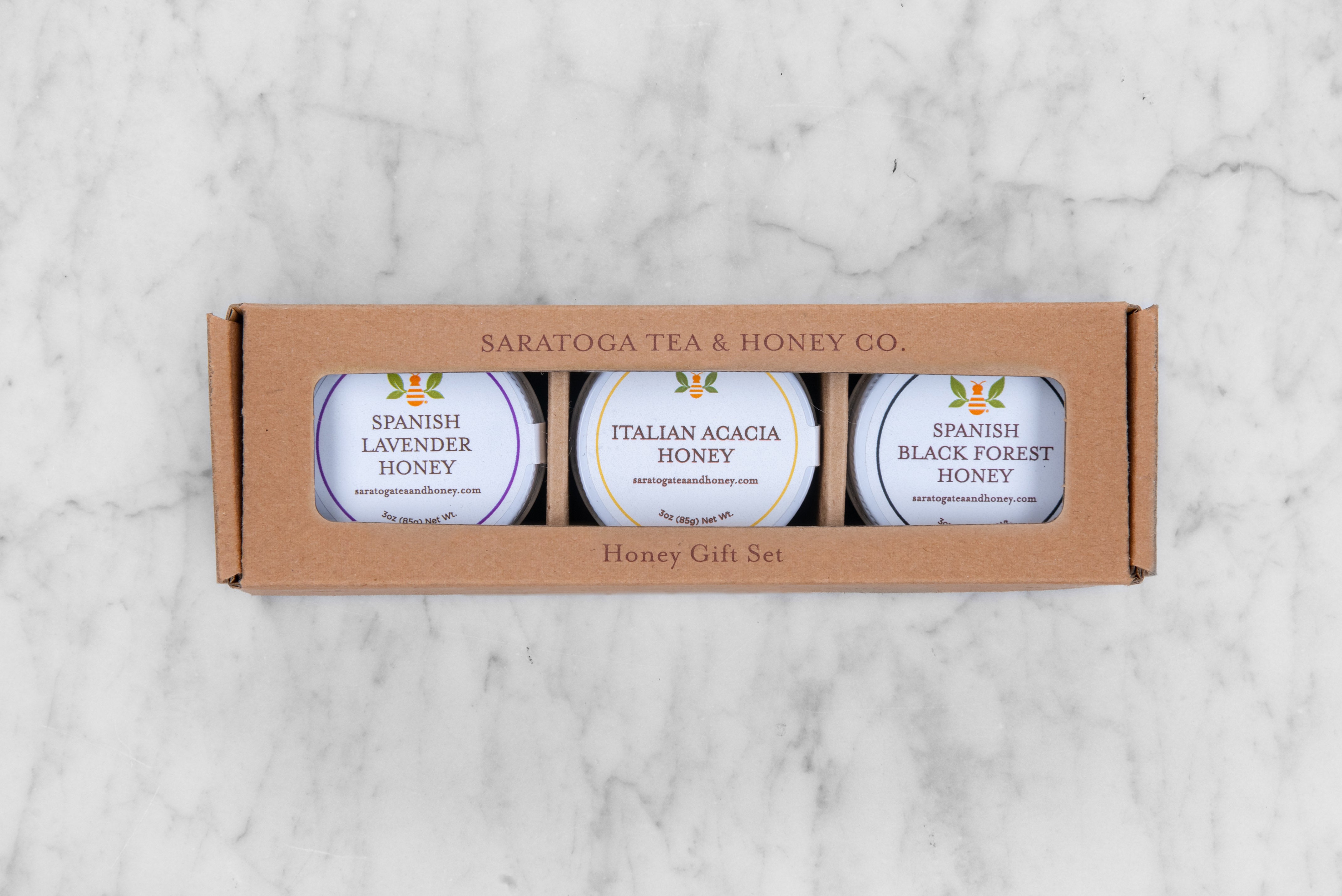 European Honeys Gift Set / Sample Pack in brown kraft box featuring Spanish Lavender Honey, Italian Acacia Honey, and Spanish Black Forest Honey