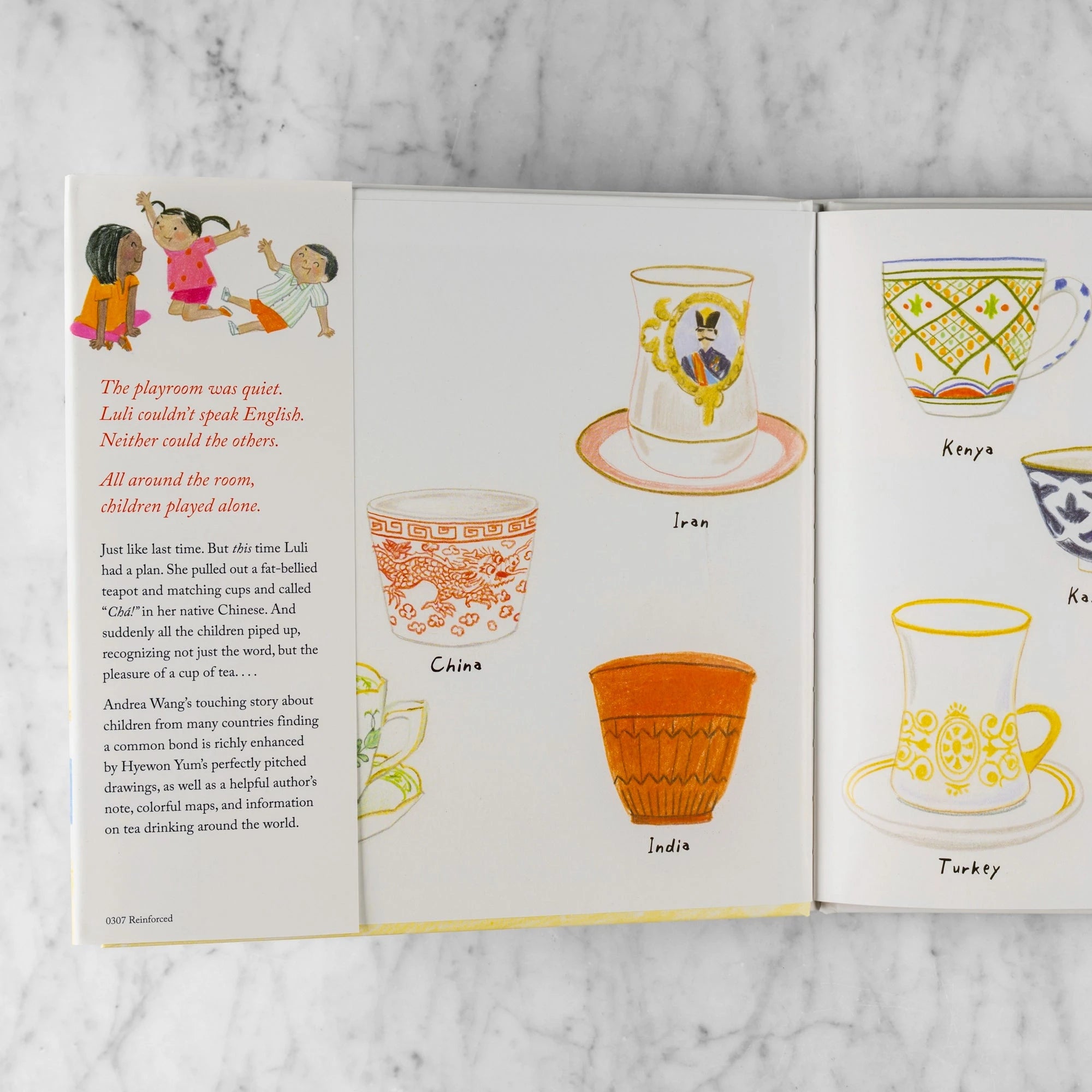 Inside flap of Luli and the Language of Tea. Shows kids playing and different tea cups from around the world. Reads: The playroom was quiet. Luli couldn't speak English. Neither could the others. All around the room, children played alone. Just like last time. But this time Luli had a plan. She pulled out a fat-bellied teapot and matching cups and called "Cha!" in her native Chinese. And suddenly all the children piped up, recognizing not just the word, but the pleasure of a cup of tea... 