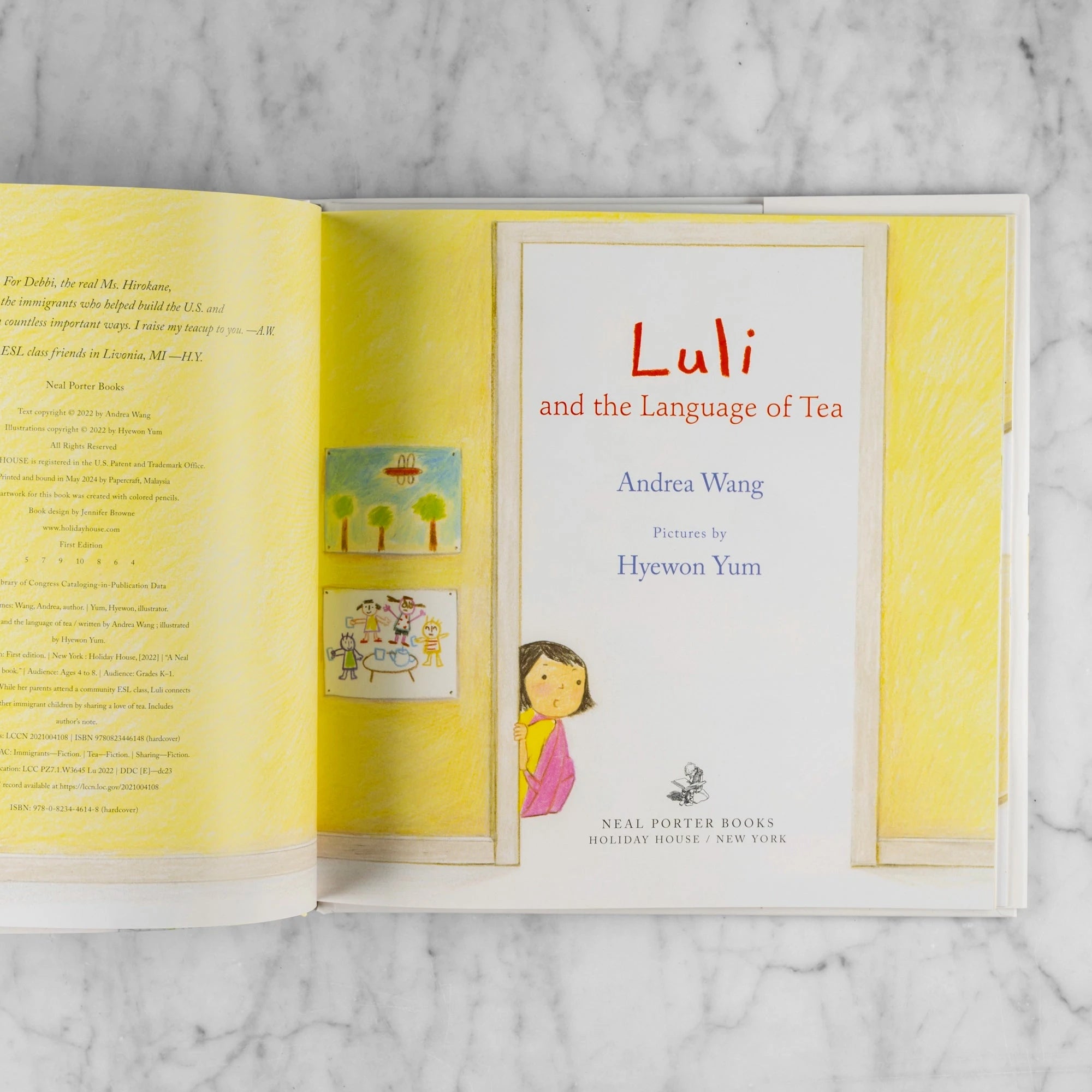 Title page of Luli and the Language of tea by Andrea Wang. Shows a little girl with black hair peaking into a classroom. 