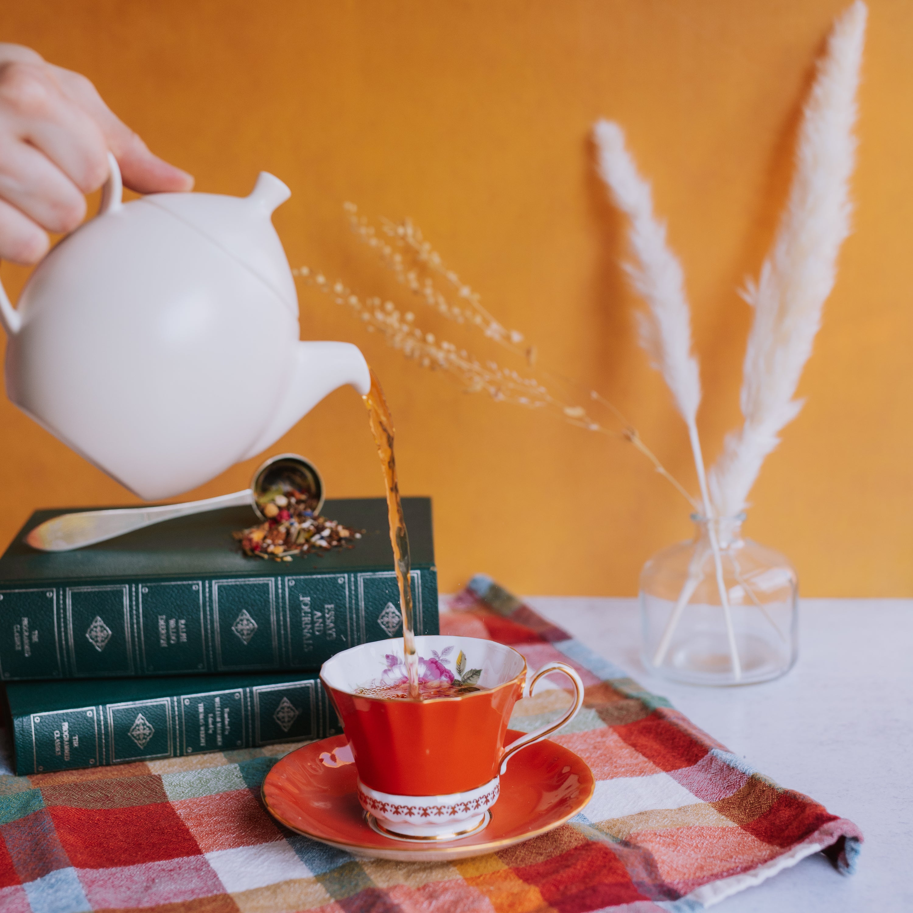 spirit of life herbal tisane poured into an orange vintage teacup