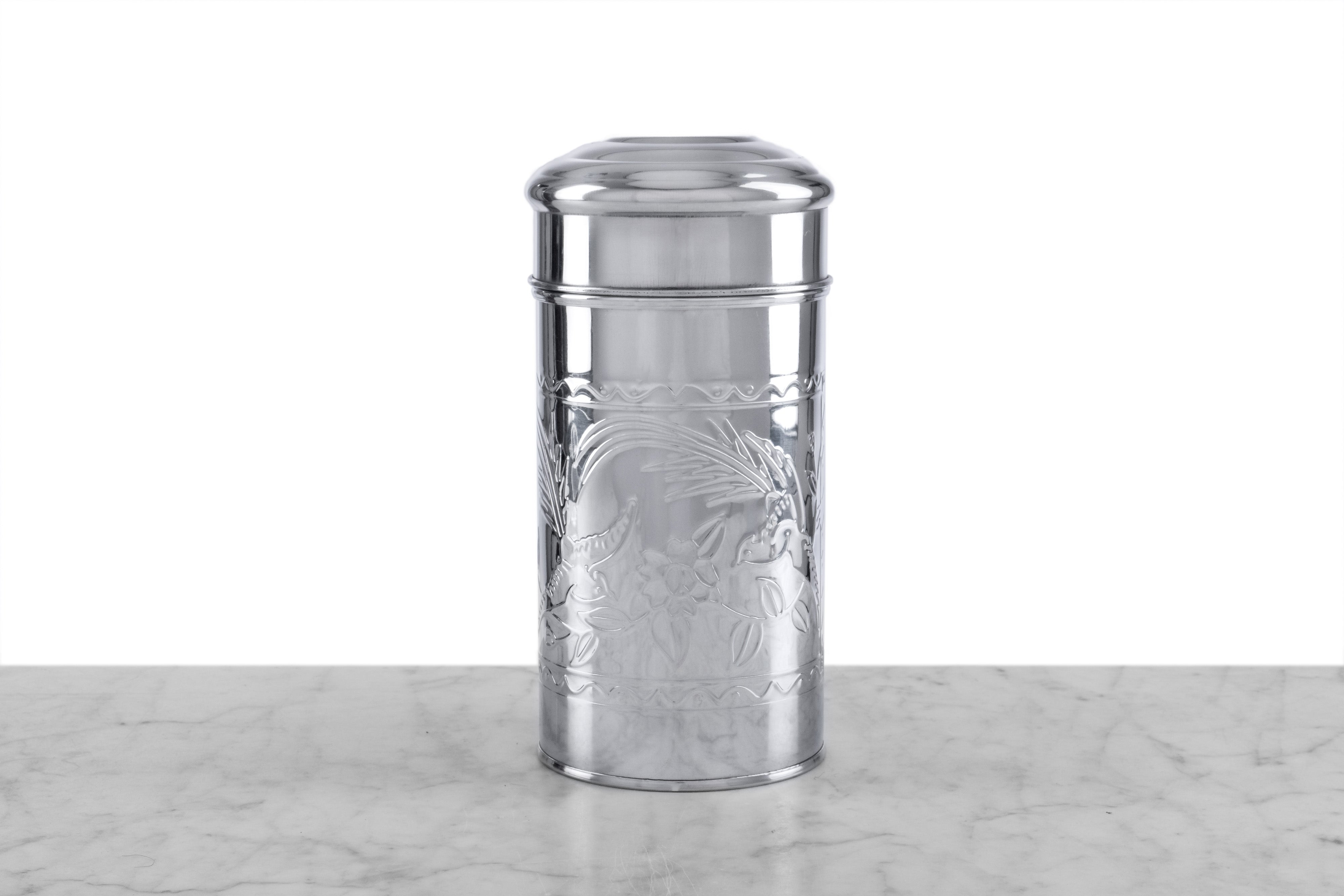 small pressed tin tea canister