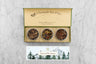winter tea gift set in green box with yellow inside reading a passion for teas and bees with three mini tins of tea and an insert card with design and tea descriptions