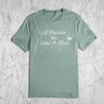A light sage green short sleeved shirt with the phrase "A Passion for Teas and Bees" on the front.