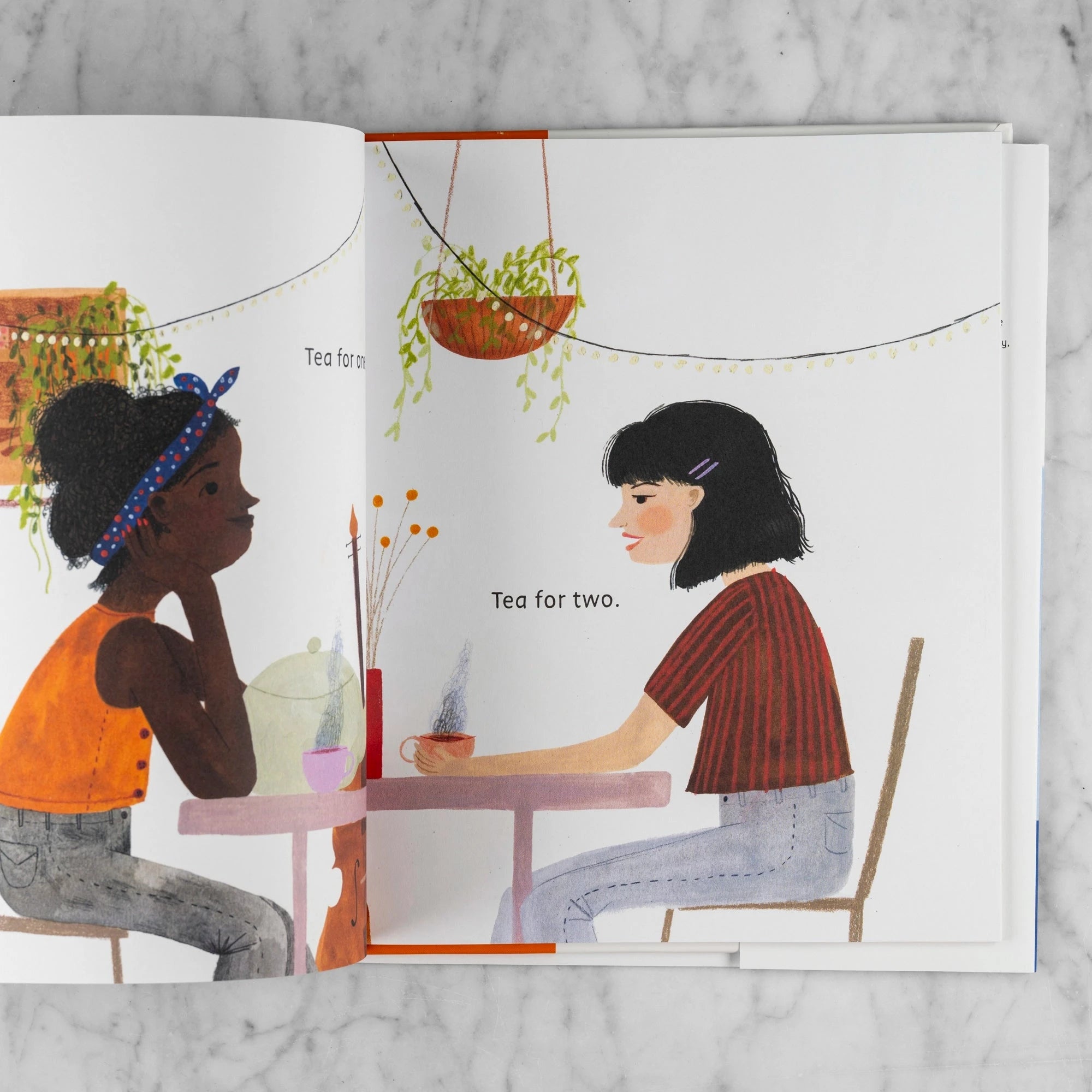 Story excerpt from Teatime Around the World. Two women of different ethnicities sit a table sharing tea. It reads: "Tea for one. Tea for two."