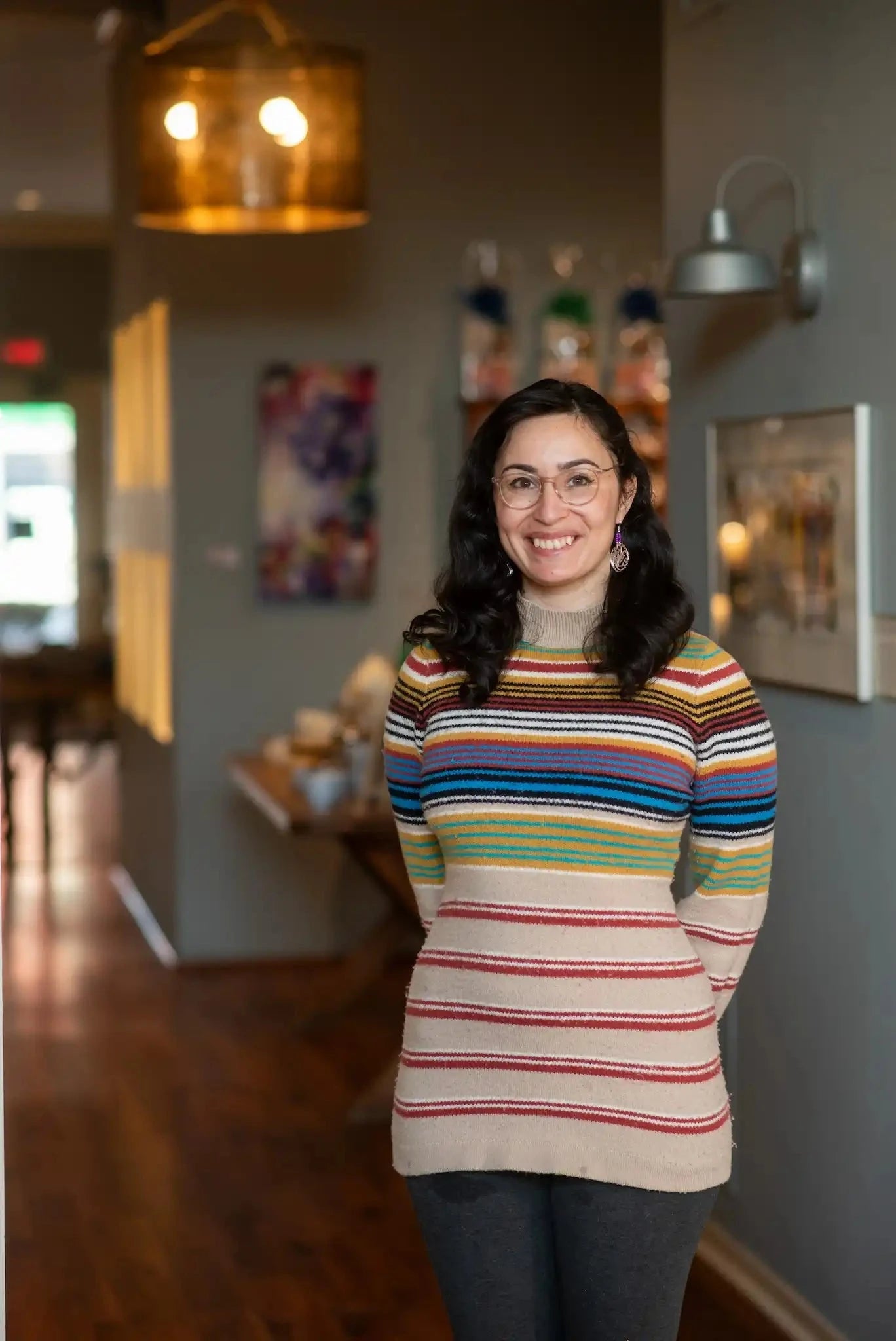 woman smiling at camera in Saratoga Tea & Honey Co.