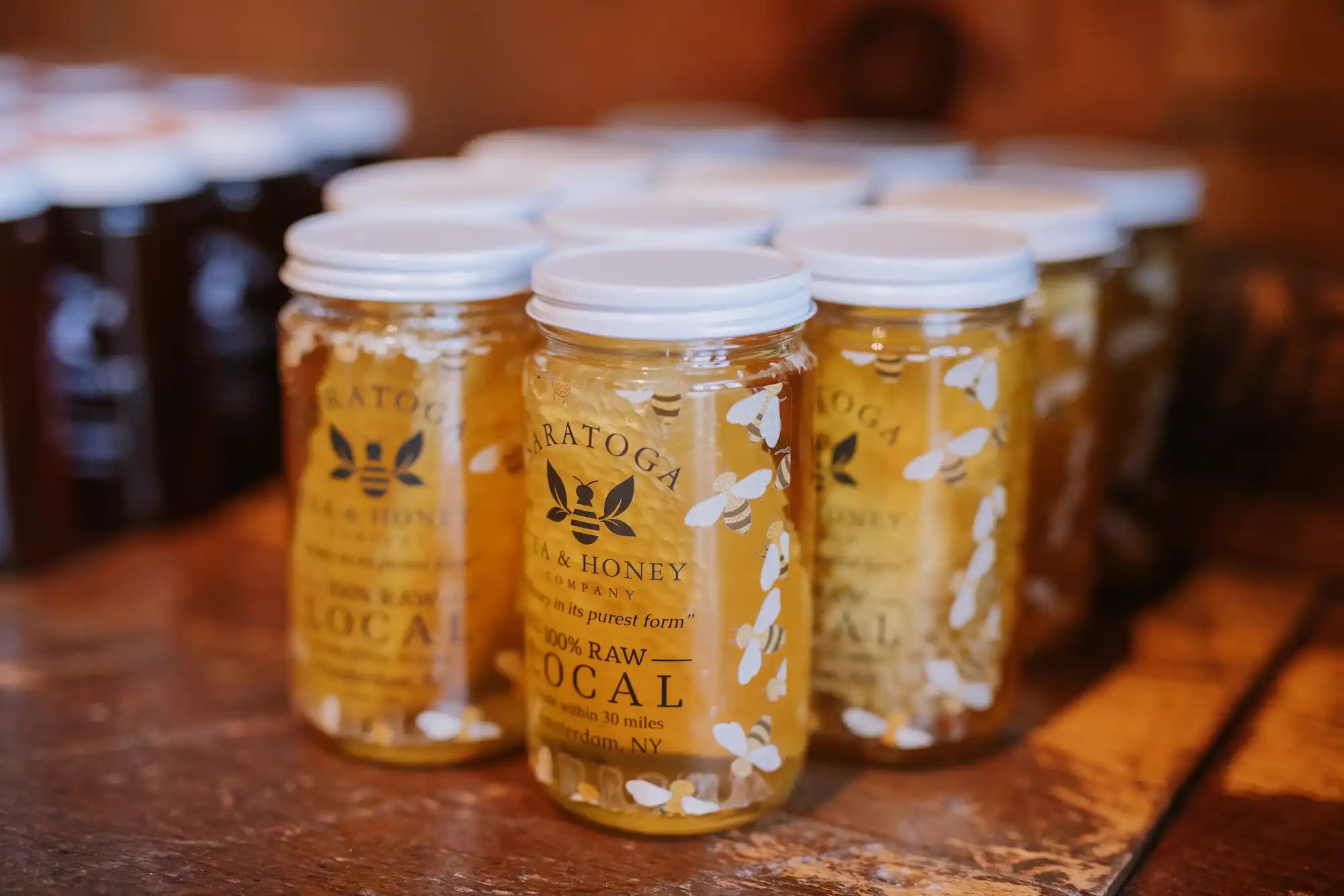 jars of honey soaked local honeycomb on the shelf at Saratoga Tea & Honey Co. in Saratoga Springs NY