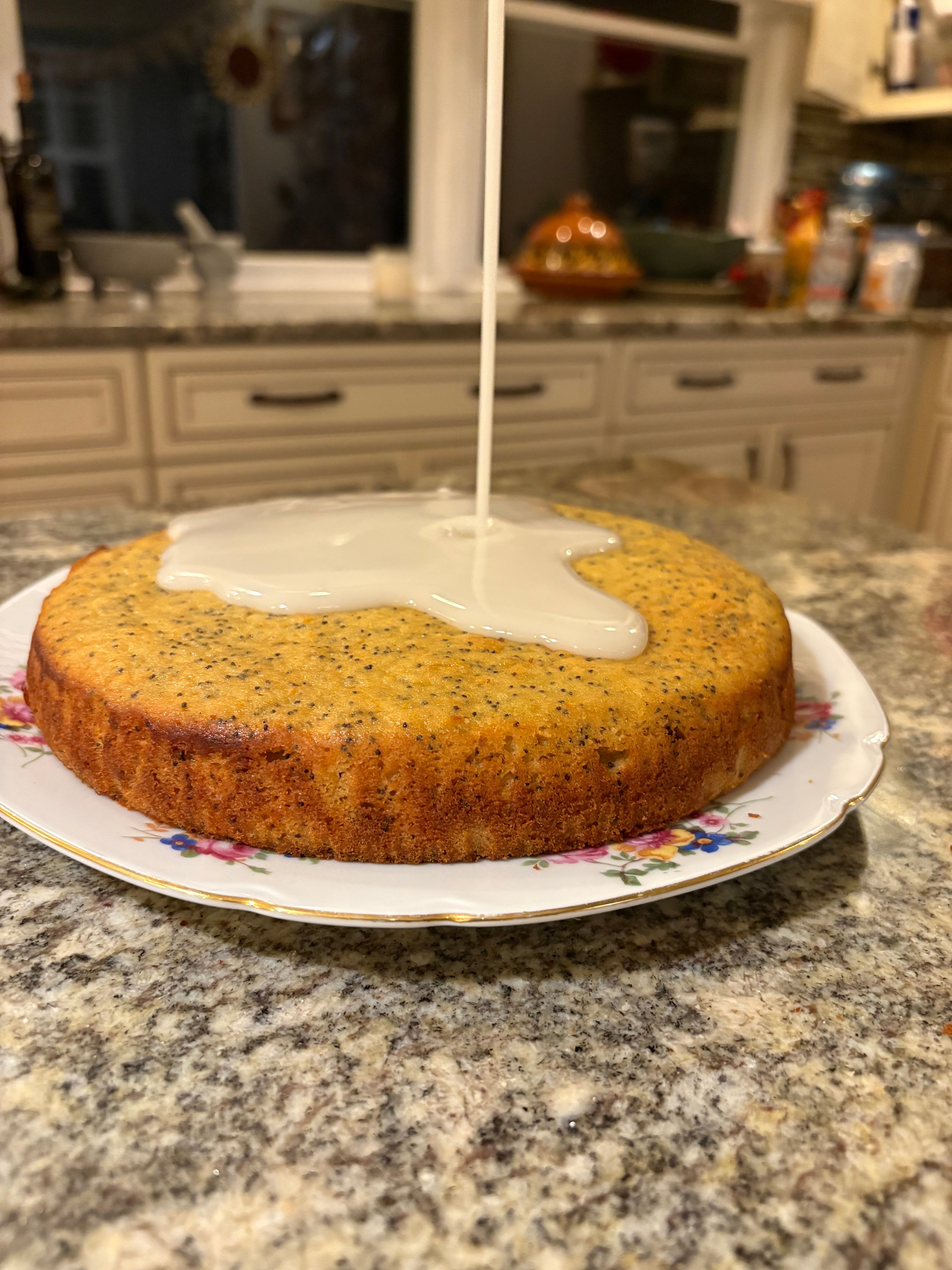 A poppyseed cake drizzled with glaze.