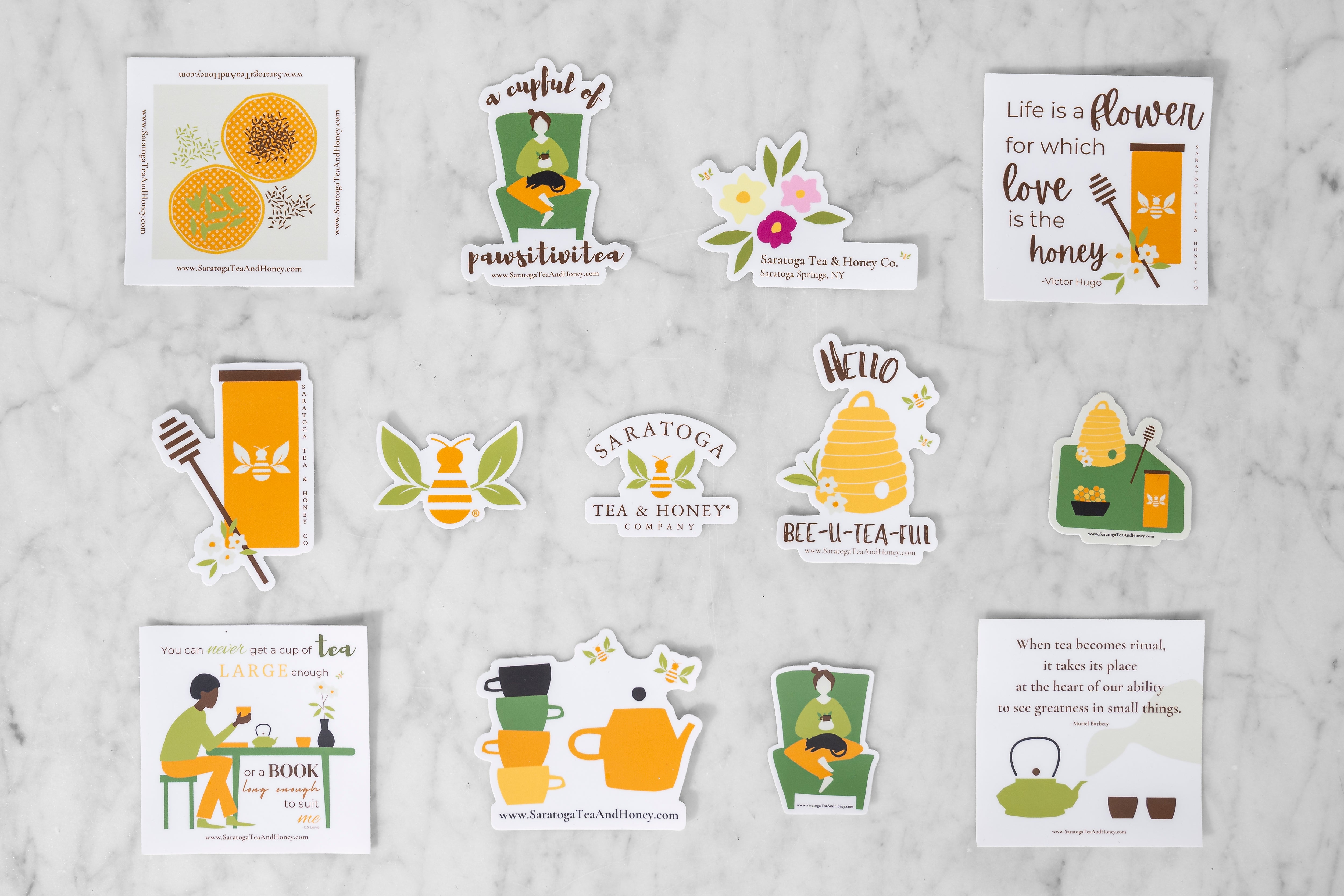 flat lay of saratoga tea and honey co tea and honey stickers
