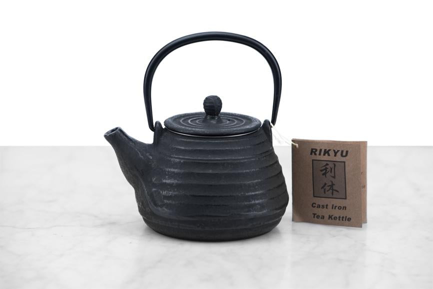 small cast iron teapot in a beehive shape