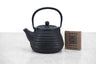 small cast iron teapot in a beehive shape