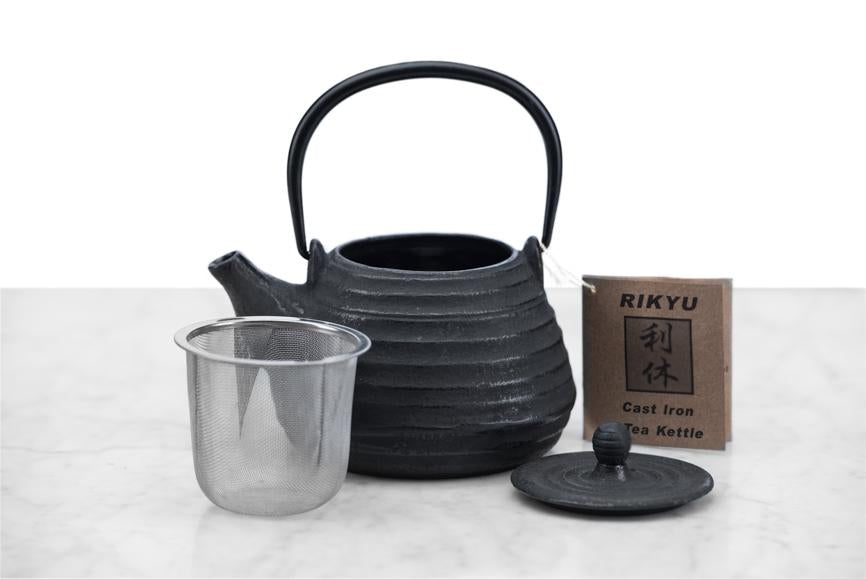 small cast iron beehive teapot with infuser basket and lid displayed separately