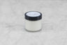 small jar of beeswax and olive oil lotion