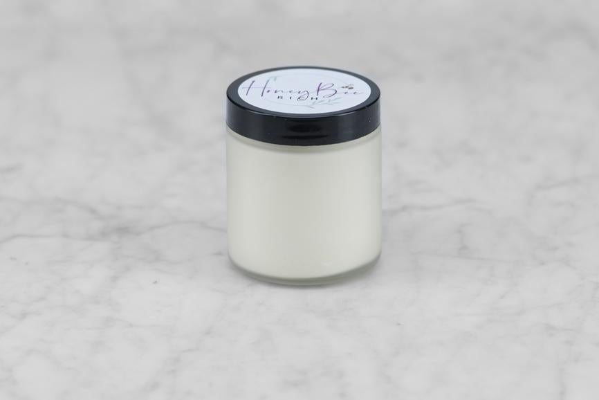 jar of beeswax and olive oil lotion from Honey Bee Rich