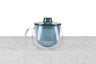 brew in glass mug with blue infuser basket