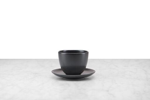 black minimalist handleless tea cup and saucer