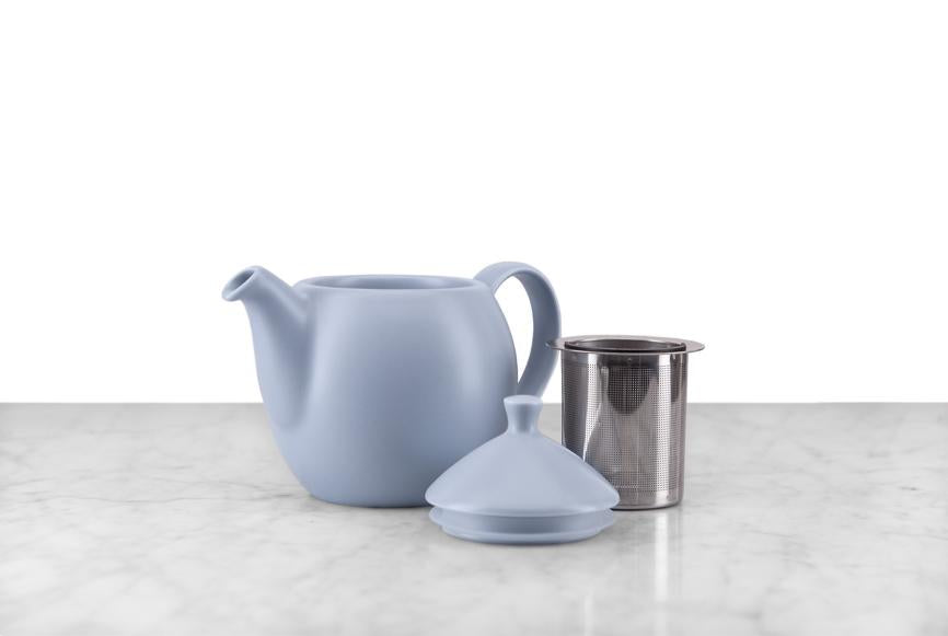 lavender-gray teapot with lid and infuser basket displayed as separate pieces