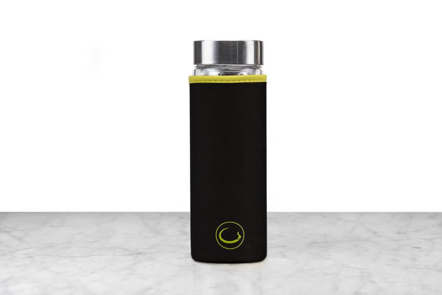 black neoprene protective sleeve with green accents on a glass tea infuser flask