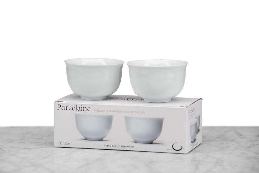two small white Japanese-style tea cups without handles sitting on their box