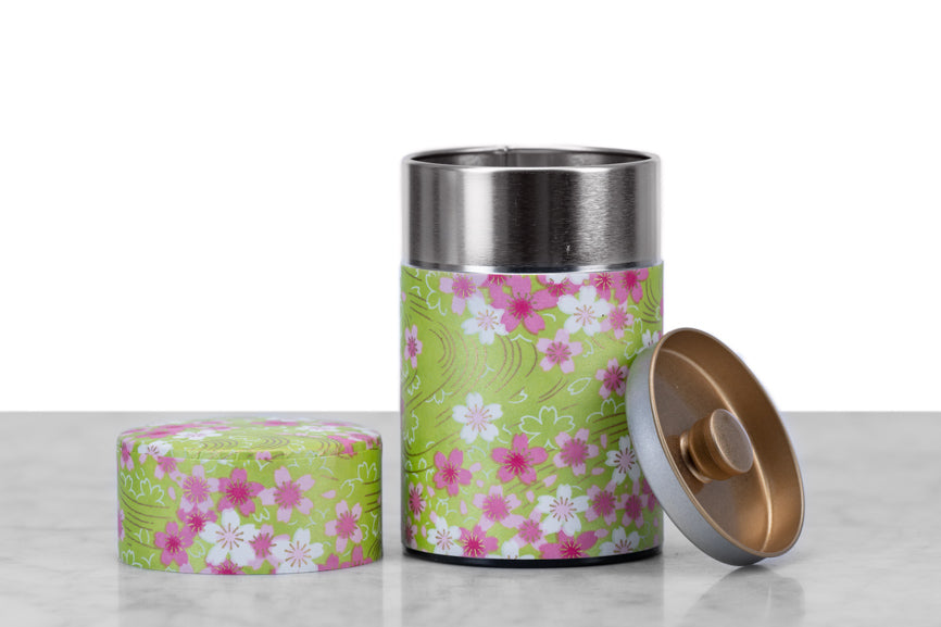green and pink flower washi paper wrapped Japanese tea tin open to show inner seal