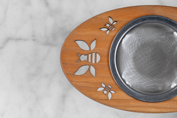 wooden and stainless steel tea infuser with bee motif