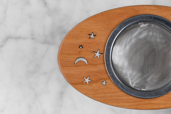 wooden and stainless steel tea infuser with stars and moon motif