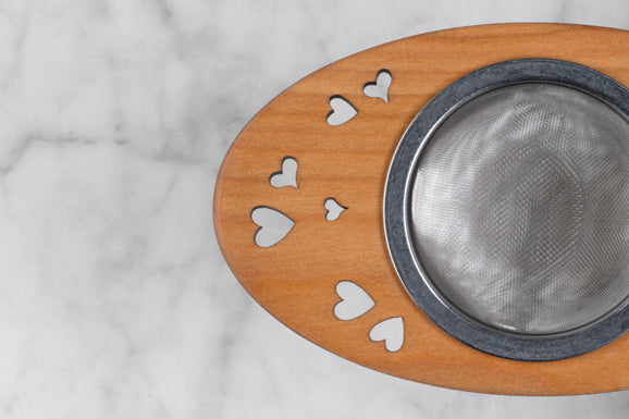 wooden and stainless steel tea infuser with heart motif
