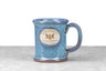 microwave, oven, and dishwasher safe blue stoneware bee mug with saratoga tea and honey co logo