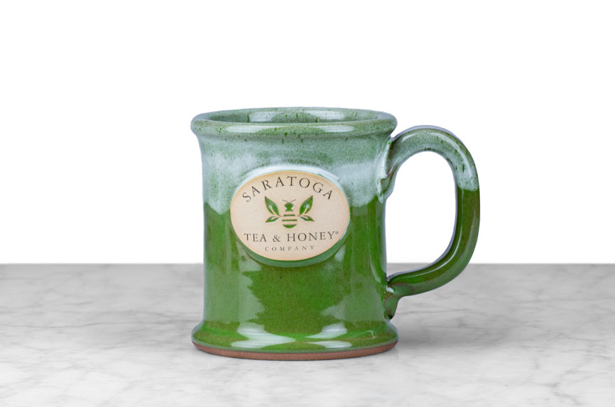 microwave, oven, and dishwasher safe two-tone green stoneware bee mug with saratoga tea and honey co logo