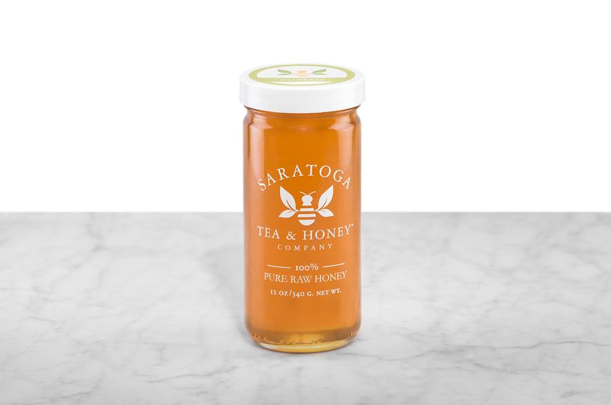 Raw Tupelo honey in a 12oz Saratoga Tea & Honey jar
