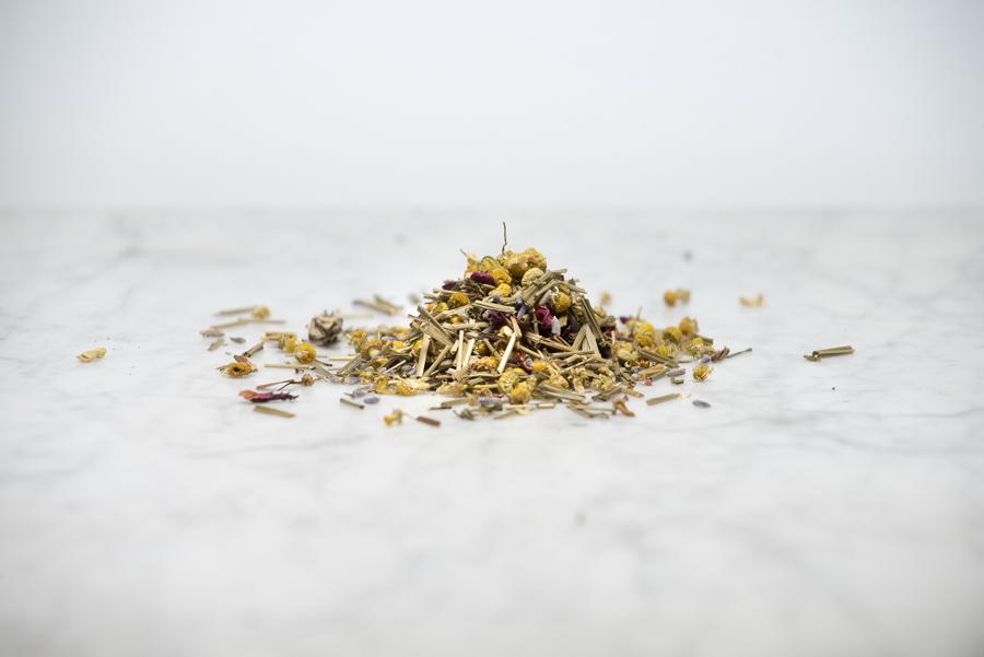 Field of Dreams loose leaf sleepy time tea ingredients on a marble background