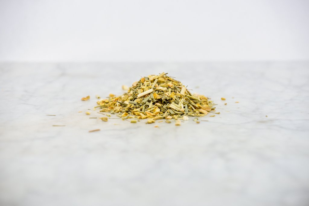 ginger and lemon loose herbal tea on a marble background