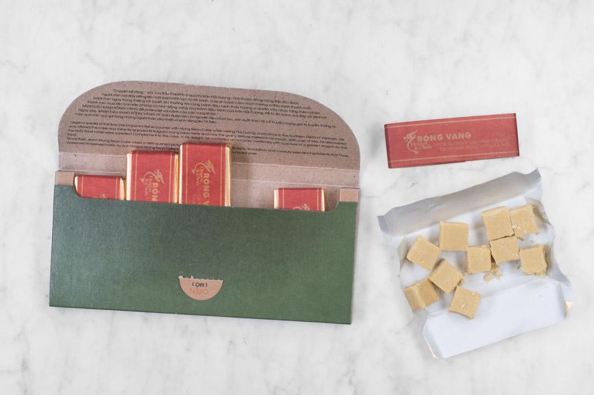 open mung bean cake package showing 5 small candy bars with an open bar showing individual mung bean cakes